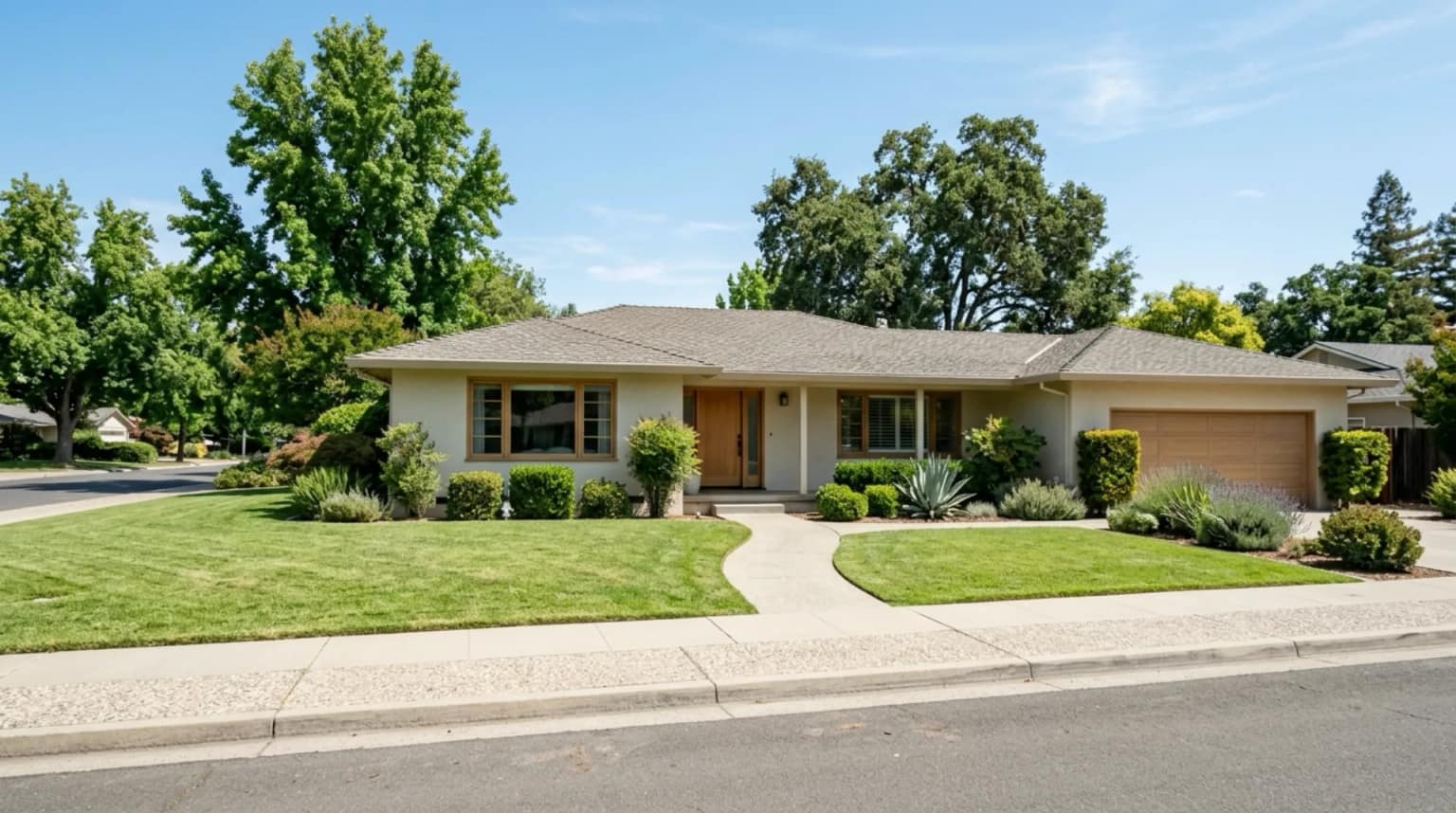 A mid-century stucco ranch home in an inland Central California neighborhood